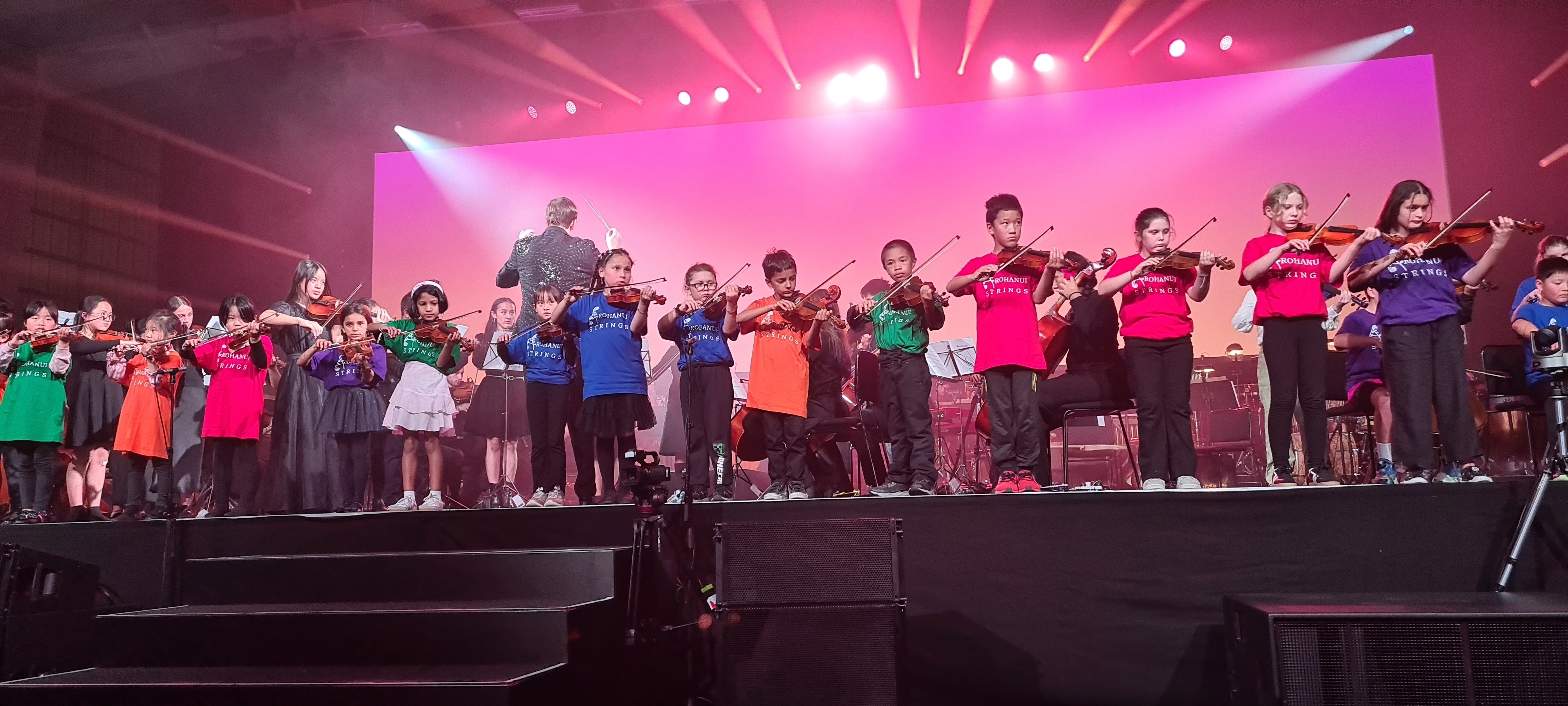 Students performing on stage